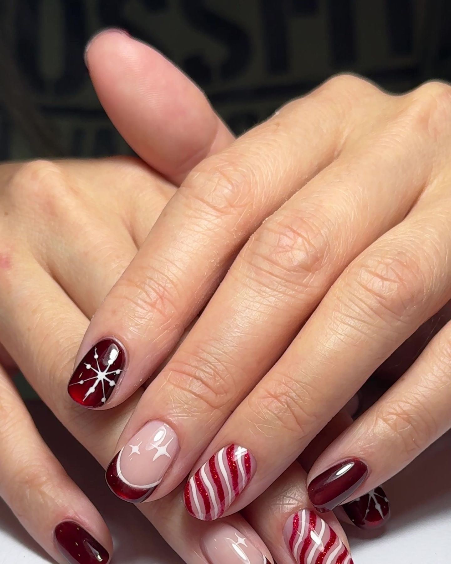 Candy-cane and ribbon holiday nail art by Megan Ho Nails
