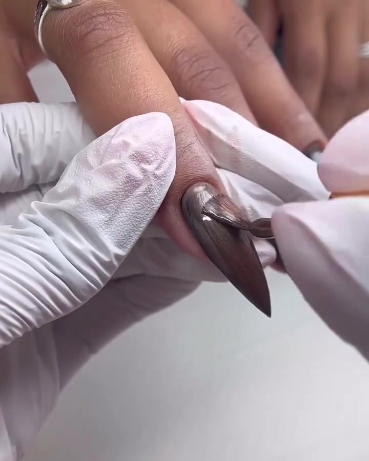 Pink nail polish, slow-motion macro